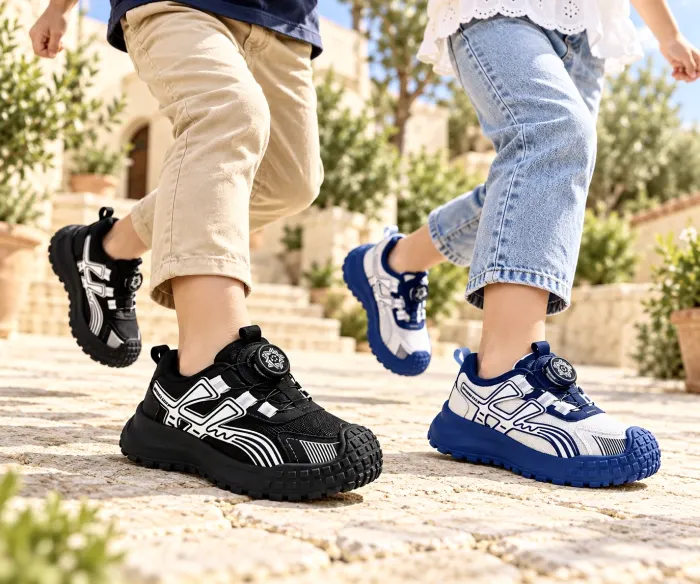 Black and blue-and-white NeoKids sneakers in action outdoors